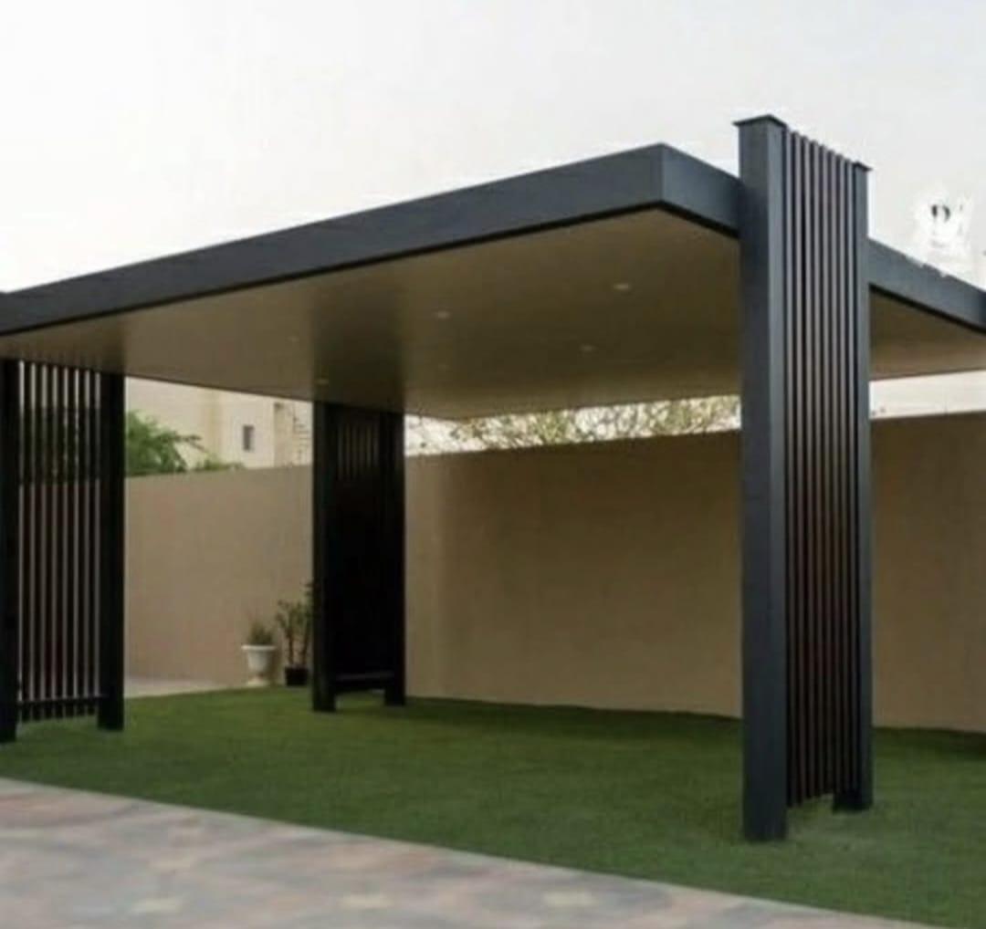 Dark aluminium canopy with slatted columns, Oman villa outdoor