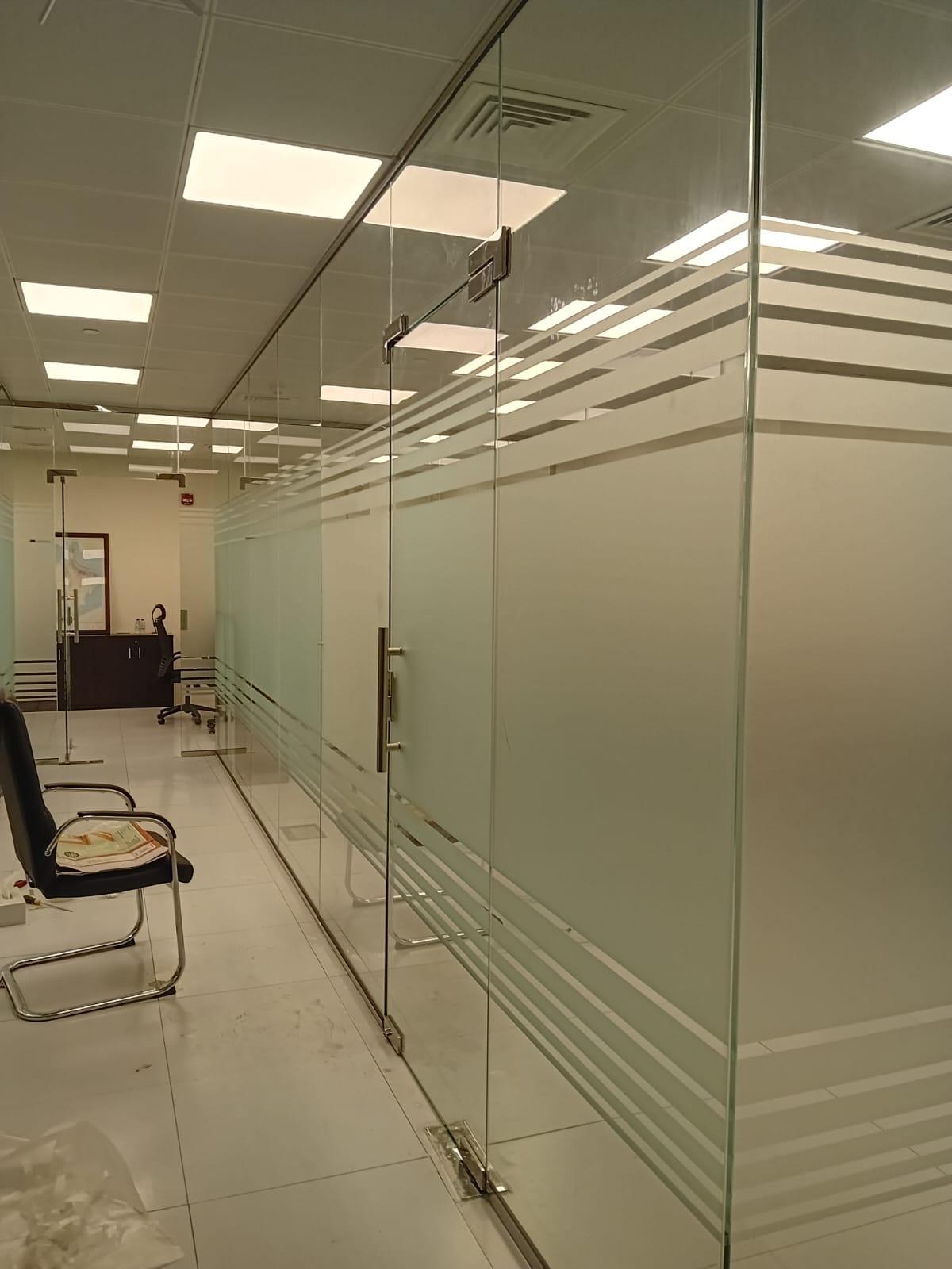 Office glass partitions with horizontal frosted privacy bands